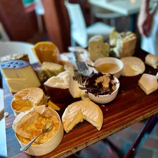 a variety of cheeses on a table