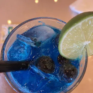 Frozen blueberries in the blue lemonade