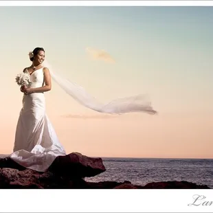 Eric is amazing! You could never tell a storm was coming, the water was brown or that my dress and veil was dirty and wet!