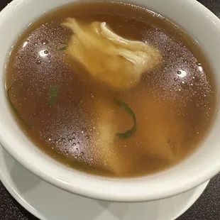 Murky wonton soup with added soy sauce.