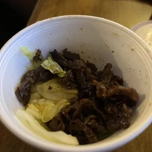 Bbq beef with a layer of cabbage to trick you into thinking you got more meat than you actually did