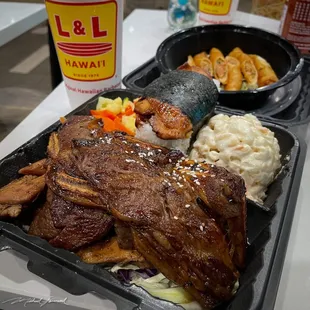 BBQ Mix Plate, BBQ Chicken Musubi, Lumpia (Egg Rolls), Macaroni Salad, Steamed Vegetables.