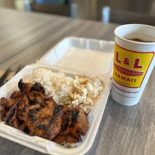 Barbecue chicken plate. Two chicken thighs, two scoops of rice one scoop, macaroni salad. Yummy.