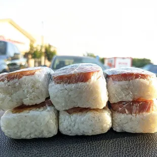 a pile of rice balls on the dashboard of a car
