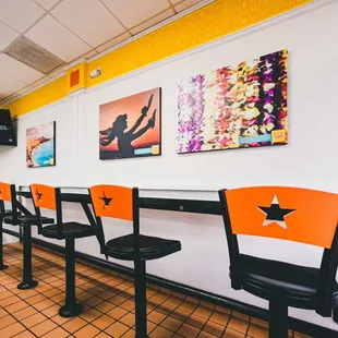 a row of chairs in a restaurant
