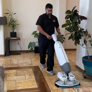 IMOP seamlessly scrubs and vacuums tile surfaces, leaving behind a spotless and polished expanse.&quot;
