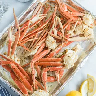 a pan of crab legs on a table