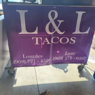 Of taco cooking station and sign