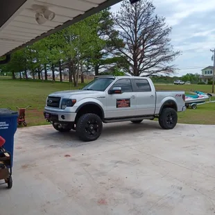 L&amp;M Small Engine Specialist LLC company tow vehicle.