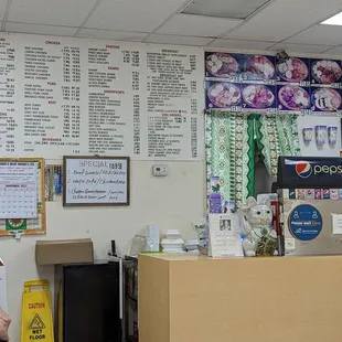 a woman standing in front of the counter