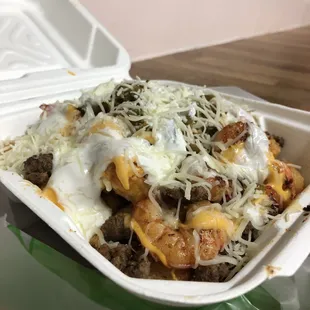 Order: Steak &amp; shrimp cheese fries with sour cream and jalapeños. Substituted fries for tater tots which is $1 extra.