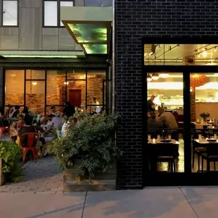 people sitting outside a restaurant