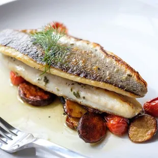 a plate of fish and vegetables