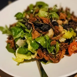 a plate of salad on a table