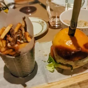 a burger and fries on a tray