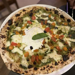 Pesto pizza. Very good but very thin. Wish I would have gotten it without the burrata.
