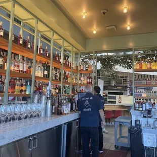 a man standing at a bar