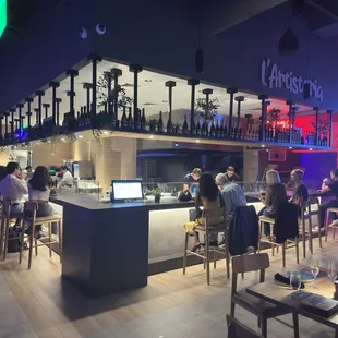 people sitting at a bar