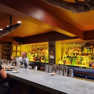 a man and a woman at a bar