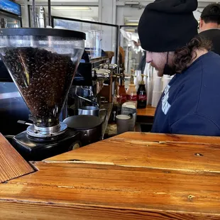 a bari serving coffee