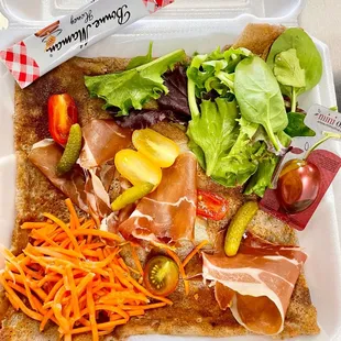 a meal in a styrofoam container