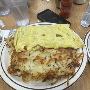 Veggie omelette with bacon and hash browns