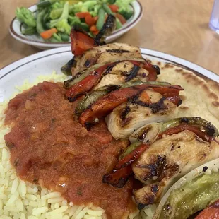 Chicken kebab, rice, red sauce, mixed vegetables