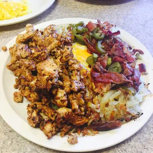 Hash Browns, Cheddar Cheese, Grilled Chicken, Bacon, and Jalapeños. This is the best chicken I've ever had.