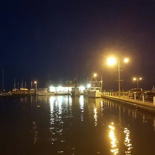 the lights reflecting in the water