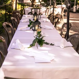a long table with white linens