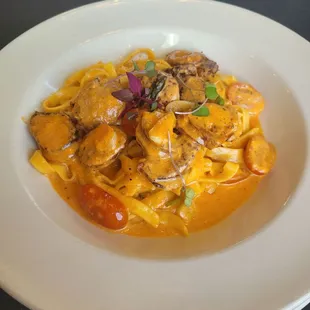 L'incontro Pasta. Very delicious linguni pasta with a creamy tomato sauce, sausage, and tomatoes.