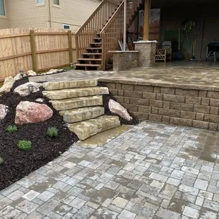 a patio with steps leading up to a patio