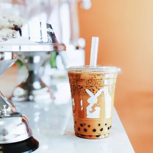 Thai milk tea with honey boba and chia seeds.