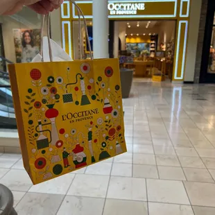 My bag of goodies and samples in front of the store