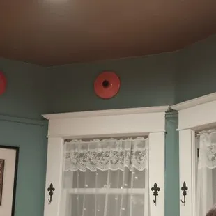 Le Creuset lids as decoration around the tops of the walls.