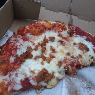 a slice of pizza in a box