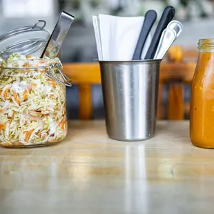 from left to right: Curtido, utensils, &amp; Salsa Roja ($0)