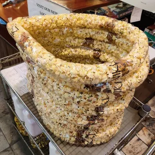 A stack of mochi crunch (arare) popcorn lei