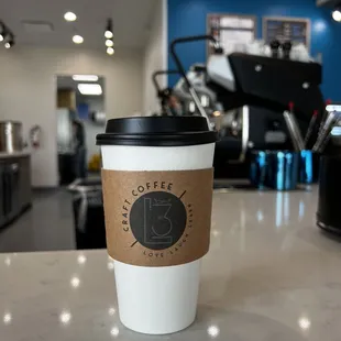 a cup of coffee on a counter