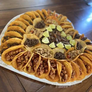Pastor, steak, chicken fajita and steak fajita tacos platter.