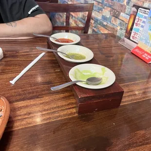 a man sitting at a table with plates of food