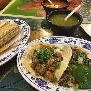 Chicken tamal, al pastor taco, carne asada taco