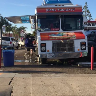 a food truck parked at a gas station