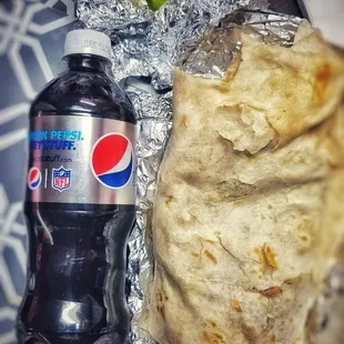 a bottle of pepsi and a tortilla