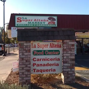 a sign in front of a building