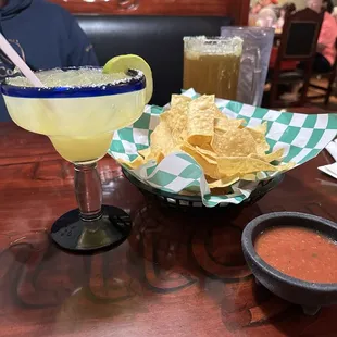 Small house margarita on the rocks and chips and salsa. Medium modelo in the back