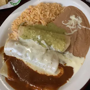 Enchiladas. Chicken w/ green sauce, beef w/ cheese sauce, and cheese w/ red sauce. The refried beans were also so smooth &amp; creamy!