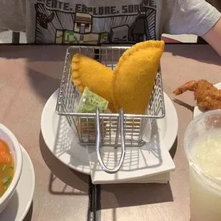 Empanadas, chicken soup, and coconut shrimp
