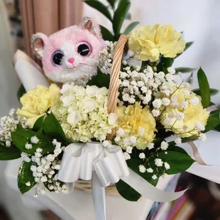 basket with stuff animal and floral arrangements, any color and bow.  45.99 pluys tax