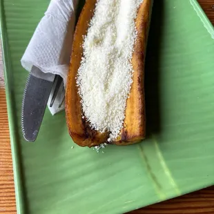 a slice of banana bread on a green plate